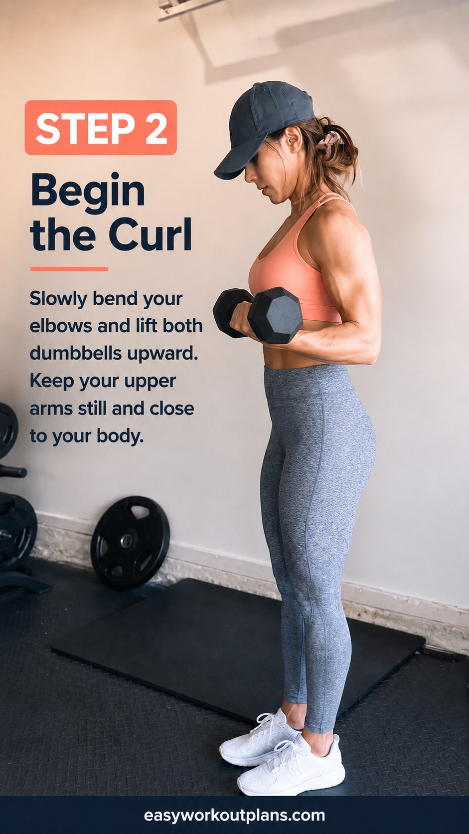 Elbows tucked in as the curl phase begins during this standing dumbbell arm workout sequence.