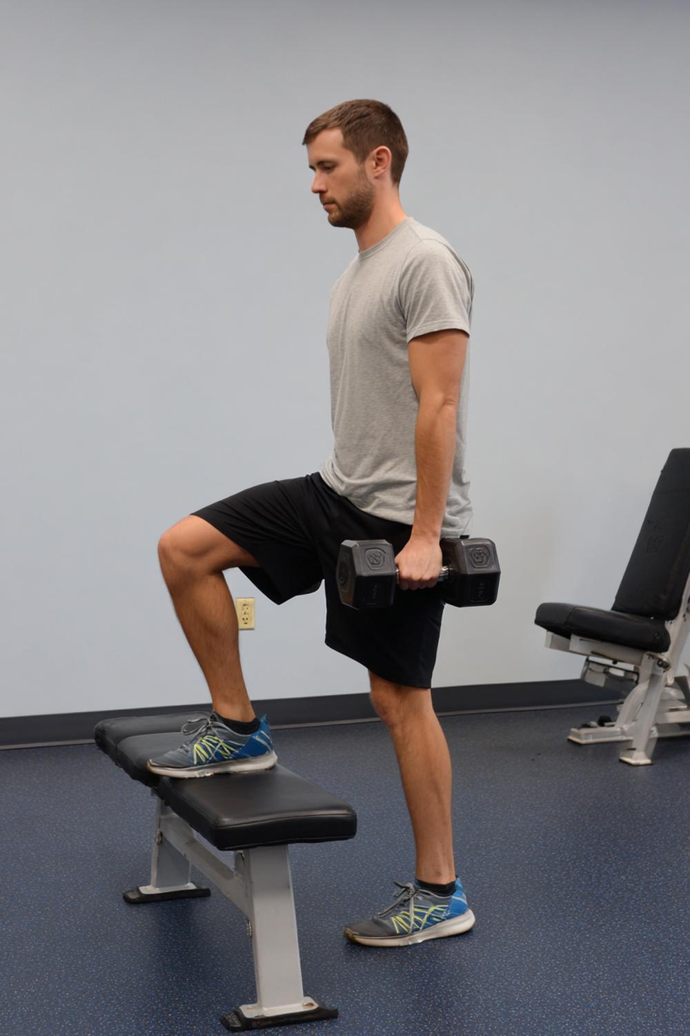 17. Full Body Weight Loss Routine: Dumbbell Step-Up Routine Using a Bench and a Strong Knee Drive