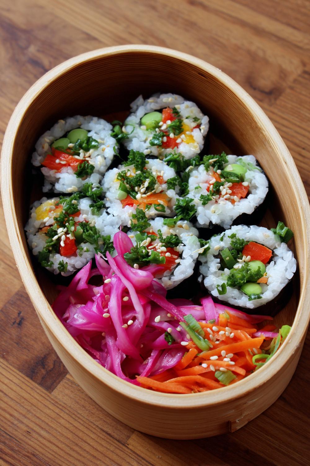 5. Sushi-Inspired Lunch Box with Brown Rice Rolls and Ginger-Sesame Slaw