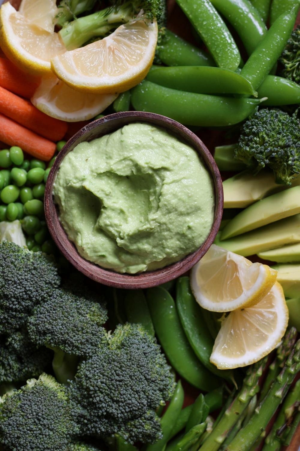 11. Green Goddess Snack Box with Snap Peas, Broccoli Florets, and Avocado-Lemon Dip