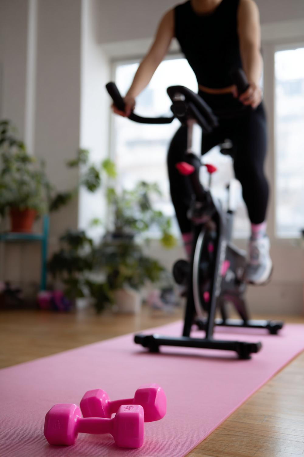 4. Peloton Workout Plan for Weight Loss: Strength + Bike Combo With Dumbbells by the Mat