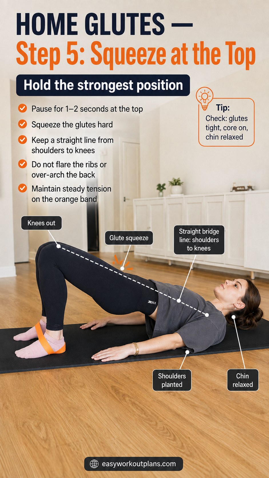 Woman holding the top squeeze position of a resistance band glute bridge with a straight shoulder-to-knee line