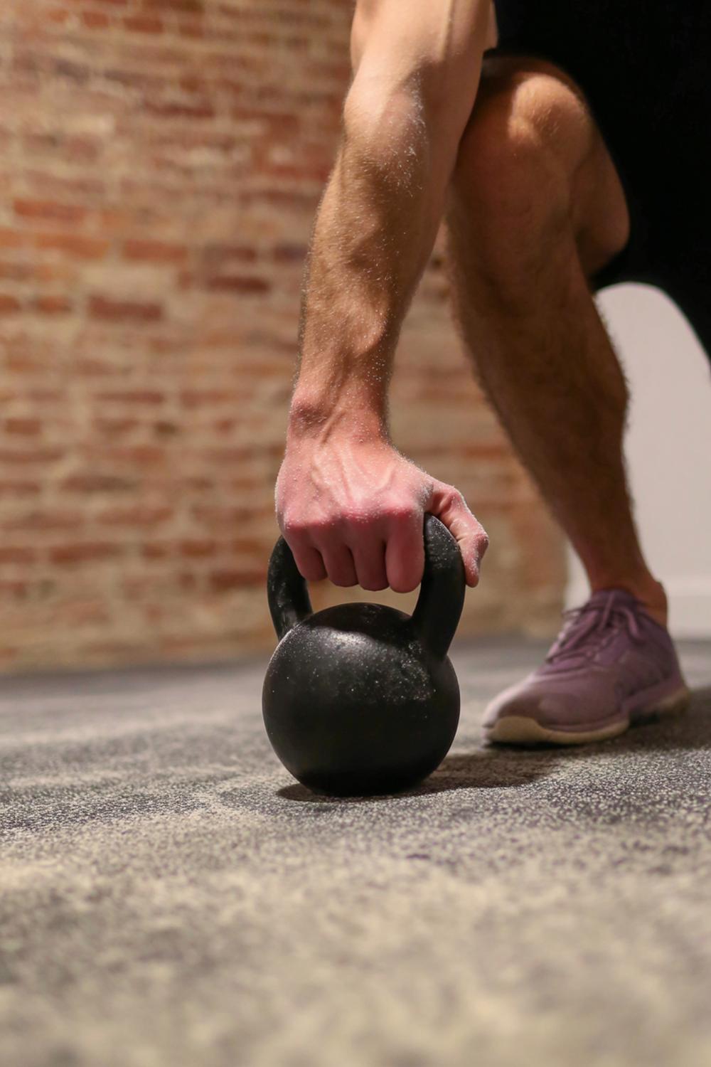 3. Weight Loss Workout Plan for Kettlebell Swing Intervals with Chalked Hands and a Concrete Floor